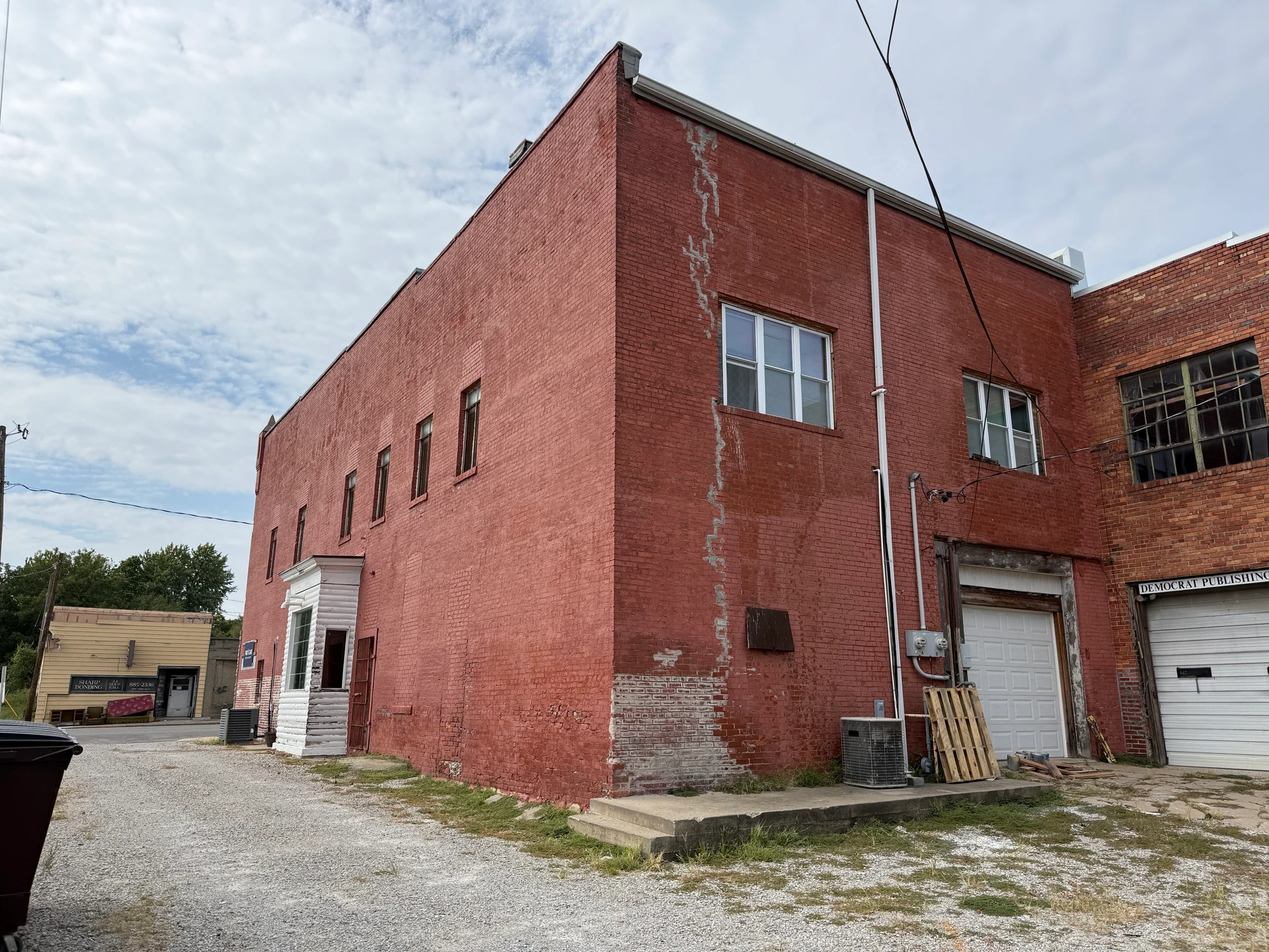 Rear corner showing the side bay and garage entrance